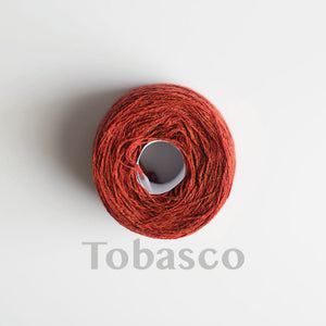 A 'Tobasco' colour yarn cake of 2/17s merino lambswool yarn
