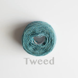 A 'Tweed' colour yarn cake of 2/17s merino lambswool yarn