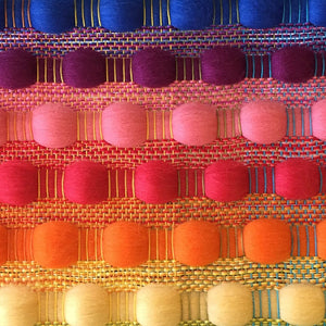 Rainbow coloured weaving sample for a weaving workshop at The Oxford Weaving Studio