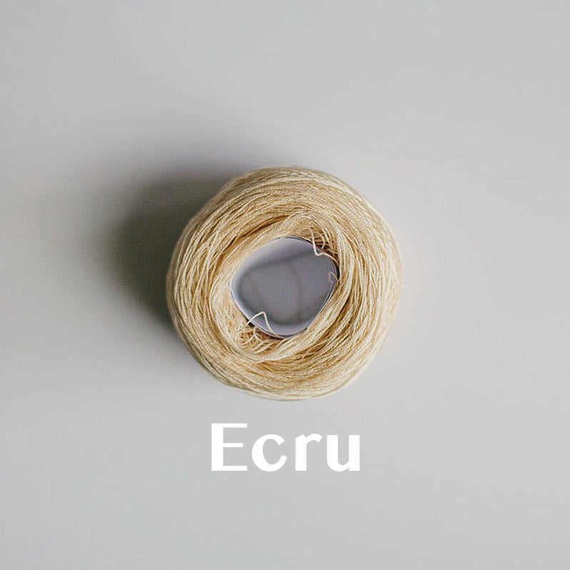 A 'Ecru' colour yarn cake of 2/16s mercerised cotton yarn