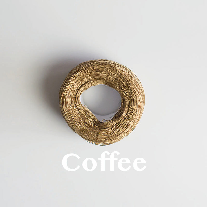 A 'Coffee' colour yarn cake of 2/16s mercerised cotton yarn