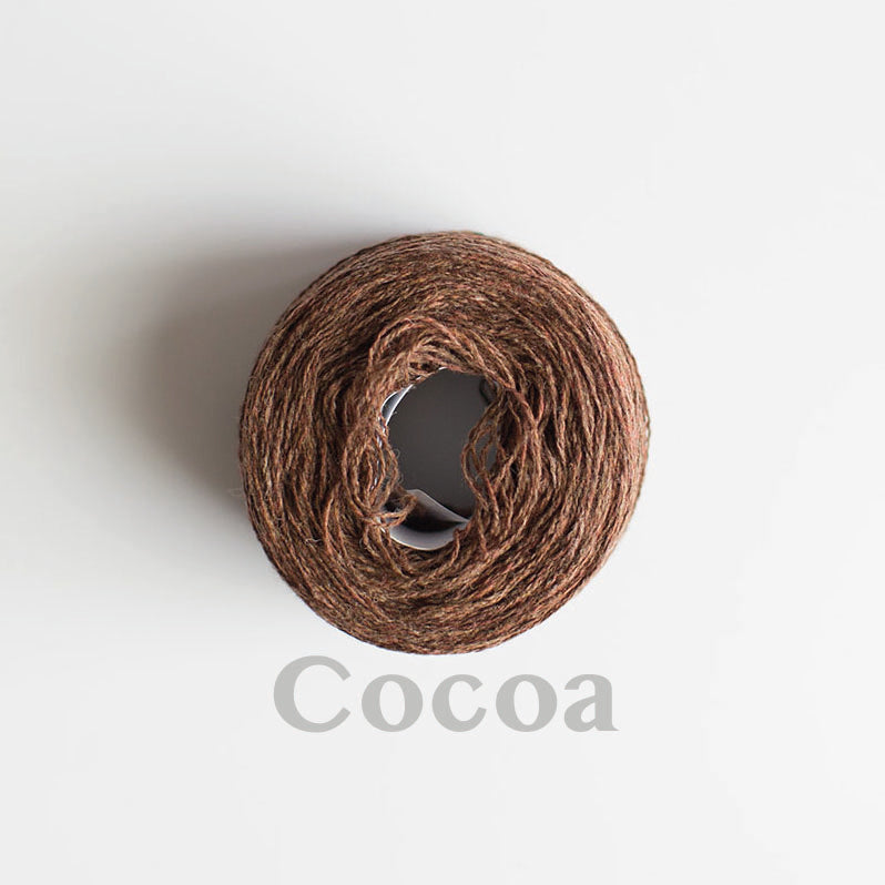 A 'Cocoa' colour yarn cake of 2/17s merino lambswool yarn