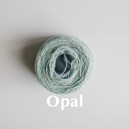 An 'Opal' colour yarn cake of 2/17s merino lambswool yarn