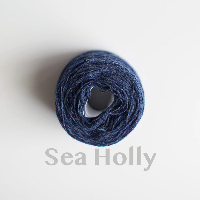 A 'Sea Holly' colour yarn cake of 2/17s merino lambswool yarn
