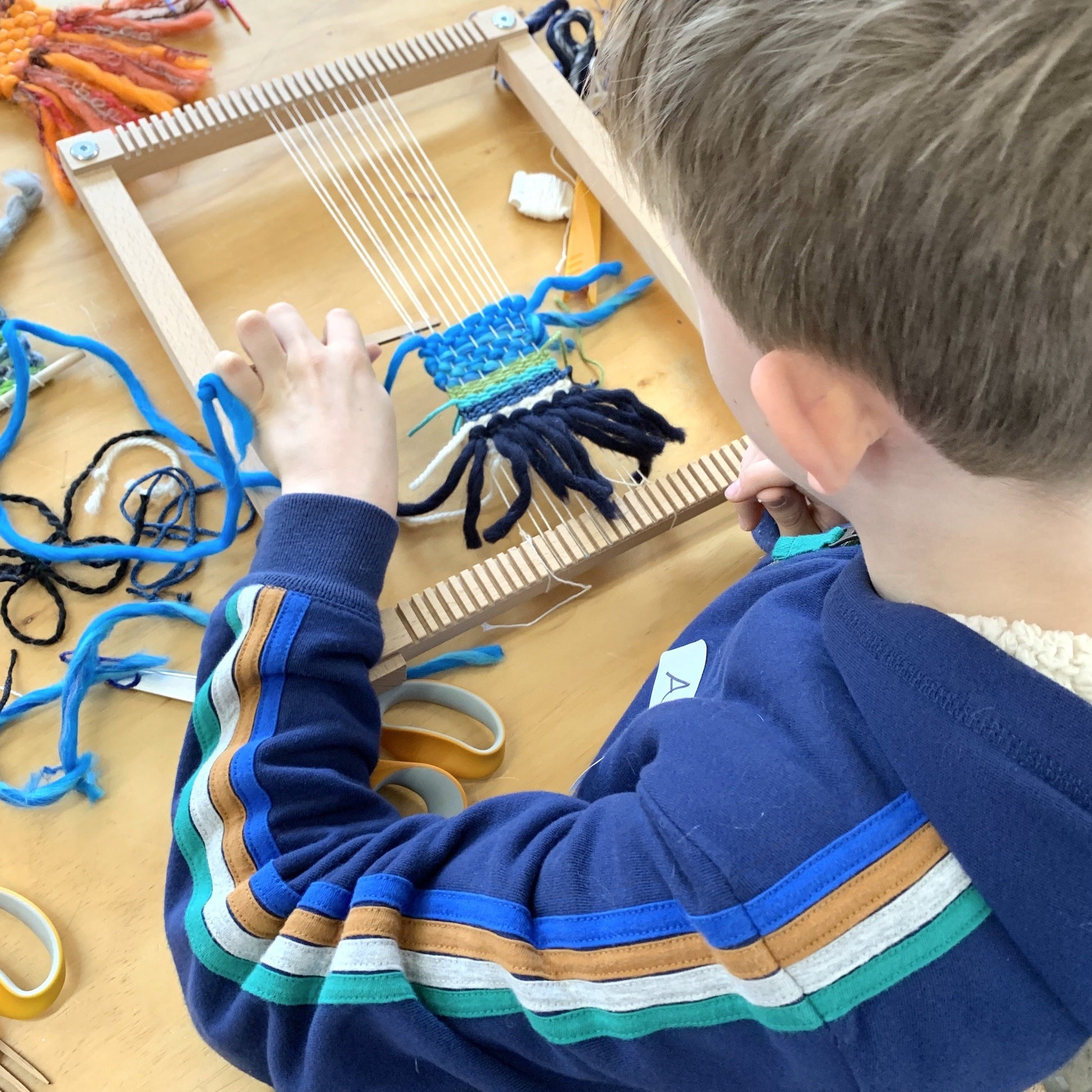 Teen learning to weave a wall-hanging with Cassandra Sabo at The Oxford Weaving Studio